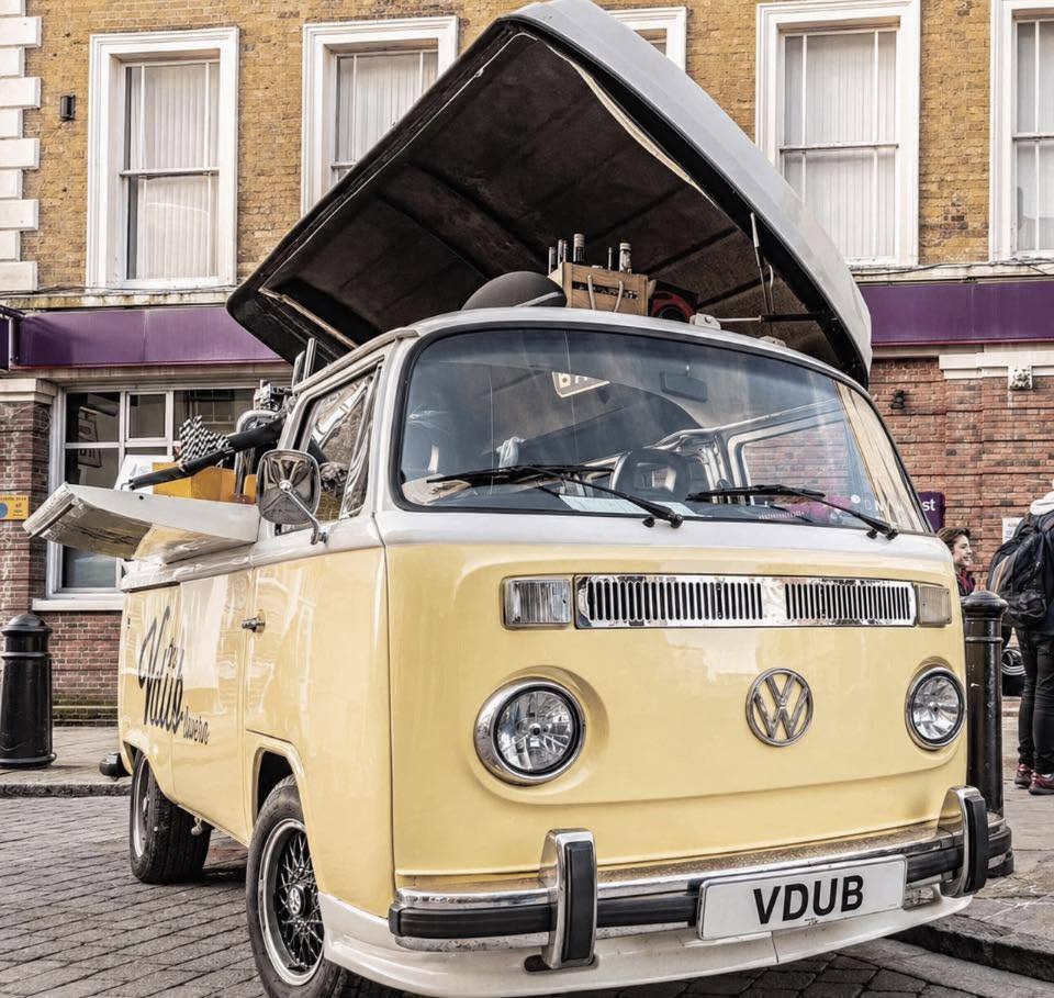 Van with open roof and business name